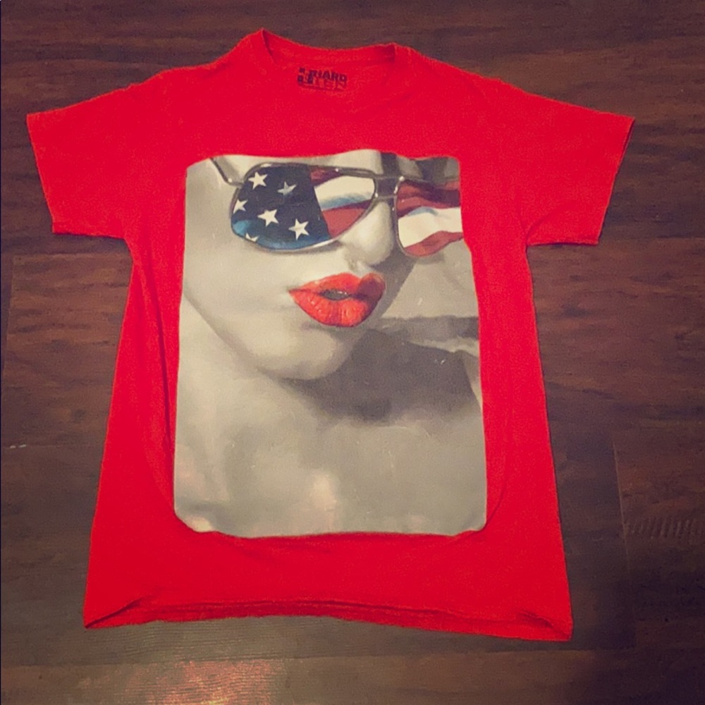 It is a red graphic tee a black and white women